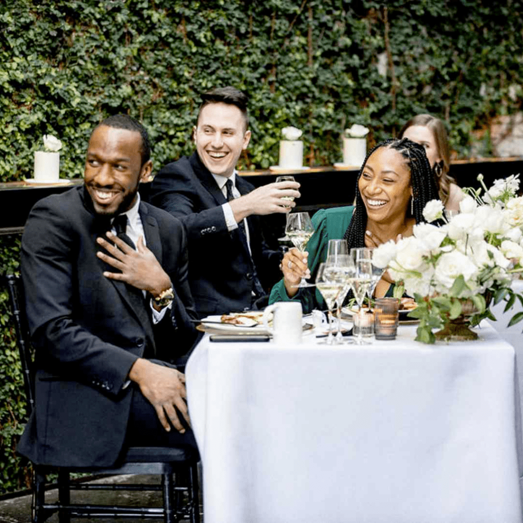 Couple enjoying the comedy at their wedding